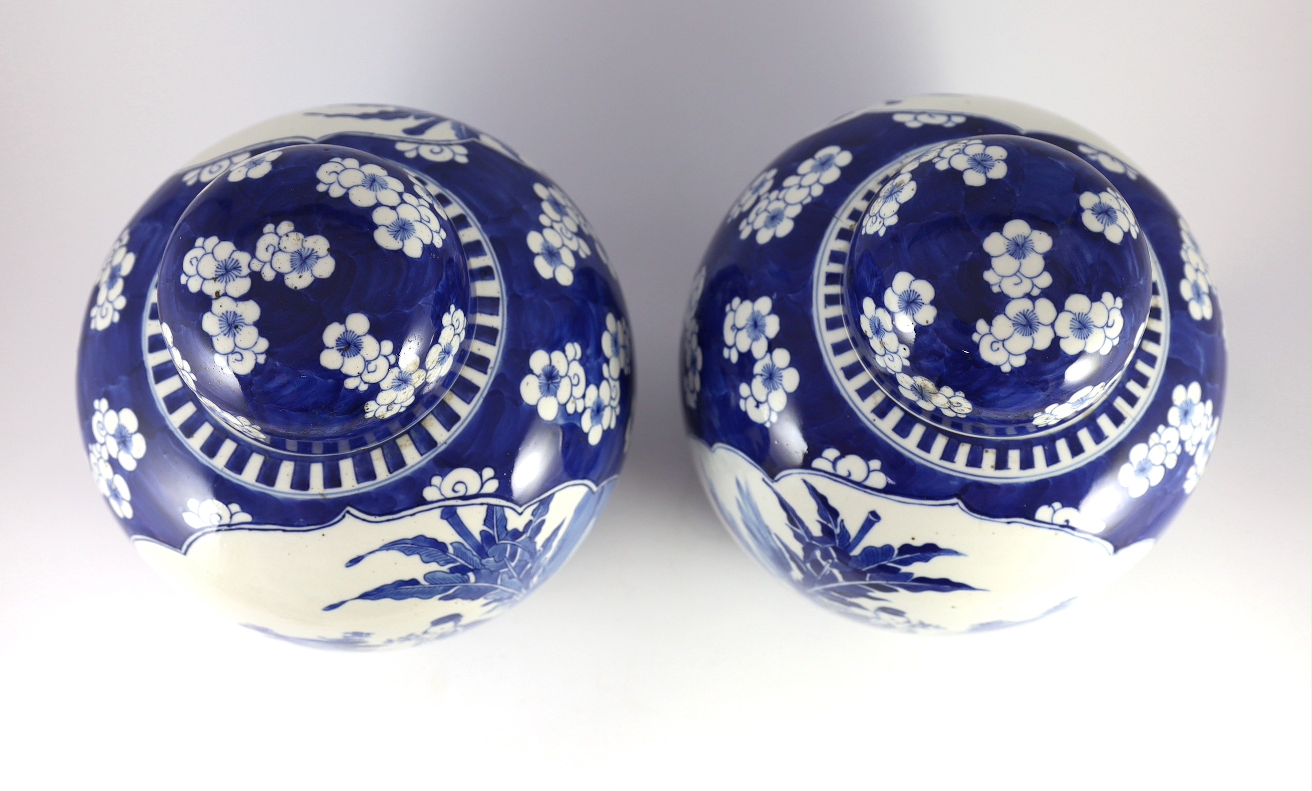 A pair of large Chinese blue and white jars and covers, 19th century, 33cm high